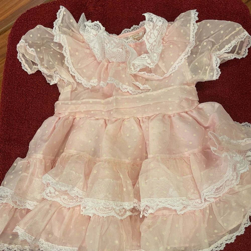 Pink with white polka dots, ribbon and lace toddler dress. Ruffle lace collar.